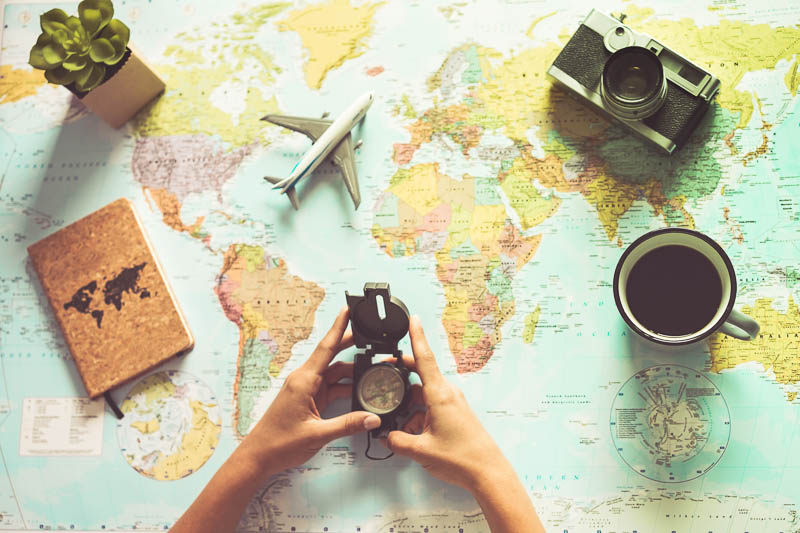 World map and compass to plan your trip